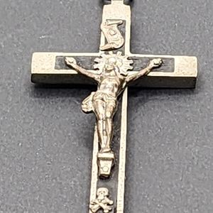 Large crucifix pendant made of silver and wood.